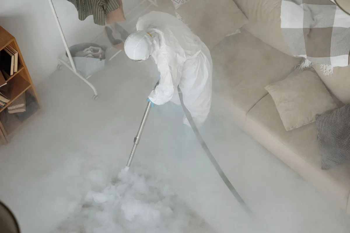 Biohazard cleanup technician in protective equipment, Shiprock, NM